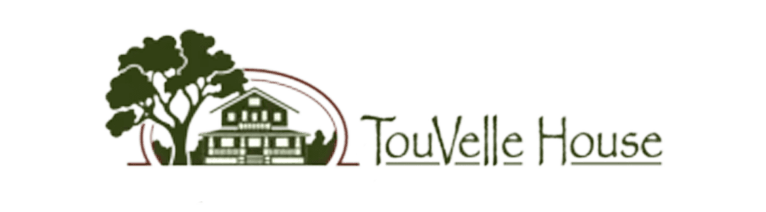 Logo of Touvelle House featuring a stylized house and tree.